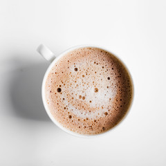 Cappuccino on a striped tablecloth. Morning coffee.