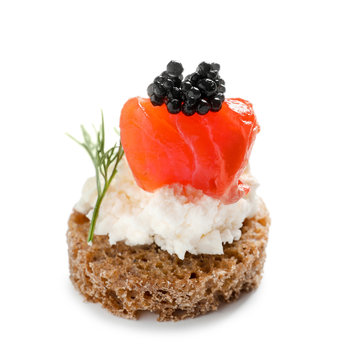 Delicious canape with black caviar on white background