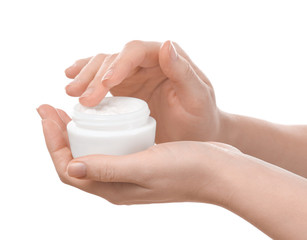 Woman with jar of body cream on white background