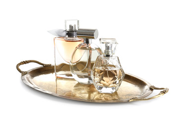 Fototapeta na wymiar Metal tray with perfume bottles on white background
