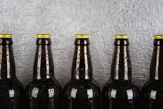 Bottles of beer on textured background