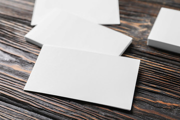 Blank business cards on wooden background