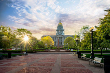 Denver Colorado state capital building with morning clouds in the sky