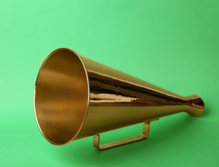 Vintage megaphone on color background