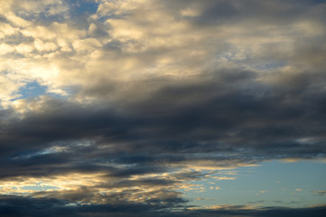 Naklejka na ściany i meble Dark cloud background at sunset
