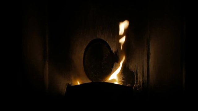 Closeup shot on flame that burns in the pellet stove 