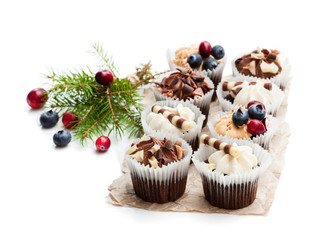 Chocolate  mini cupcakes with christmas decoration isolated on white