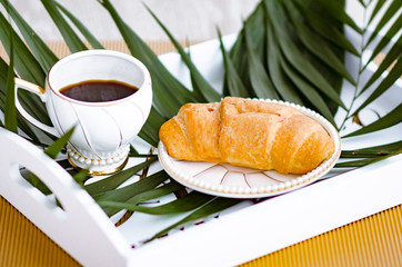 bun with a cup of coffee