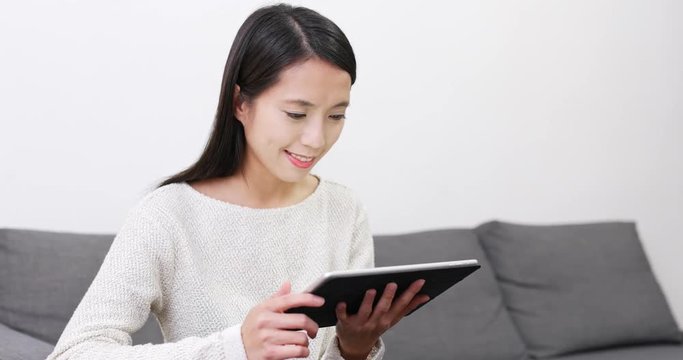 Woman read on tablet computer