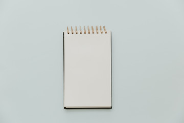 White Notebook mock up on pastel minimal background
