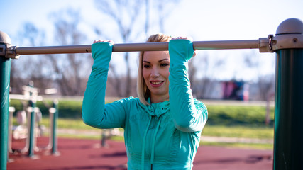 Fototapeta premium Smiling sports woman on chin