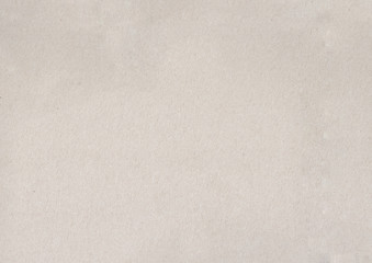 texture of light coloured kraft paper sheet with small soft brown grain dust