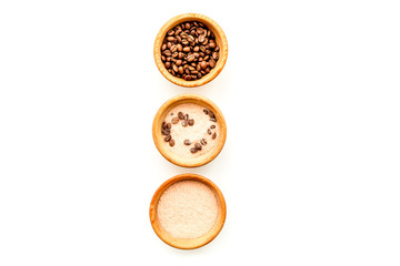 Aromatheraphy in spa. Chocolate brown spa salt on white background top view copy space