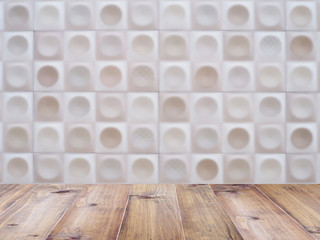 table top over abstract blurred tile wall background.