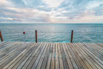 Fototapeta na wymiar Wooden Pier and Turquoise Caribbean Ocean