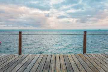 Fototapeta na wymiar Wooden Pier and Turquoise Caribbean Ocean