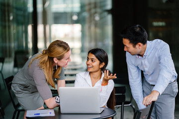 A group of professionals having a discussion fro new strategies and action plan so they can improve for the better. They are people in different cultures but working as one team.