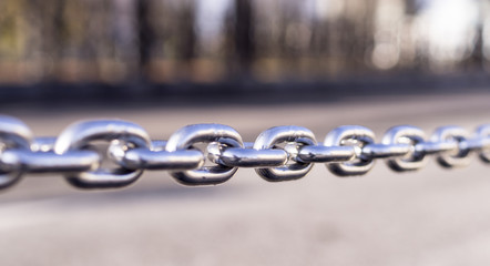 shiny steel chain city background. decoration, boarder.