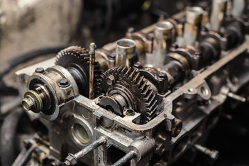 Disassembled car dirty engine close-up to engine parts at car garage