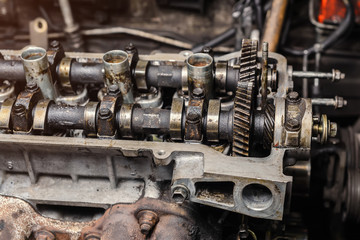 Fototapeta na wymiar Disassembled car dirty engine close-up to engine parts at car garage
