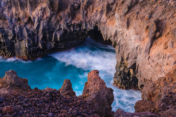 Fototapeta na wymiar Stunningly beautiful lava caves and cliffs in Los Hervideros after sunset. Lanzarote. Canary Islands. Spain