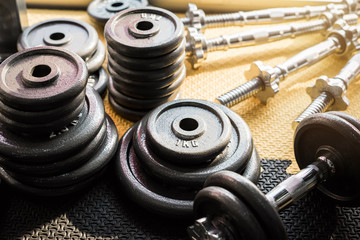 Obraz na płótnie Canvas set of equipment for weightlifting in gym