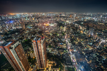Fototapeta na wymiar Tokyo - August 08, 2017 : Tokyo skyline night aerial view and highway car trails from Roppongi Hills Mori Tower.