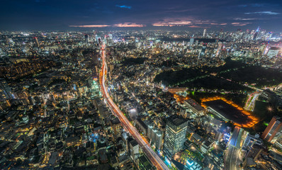 Tokyo - August 08, 2017 : Panoramic night aerial view of Tokyo skyline and highway car trails on Route 3 (Shuto Expressway) Shibuya Route from Roppongi Hills Mori Tower.