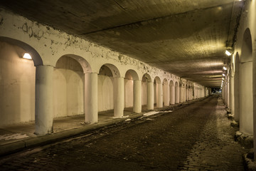 Vintage city bridge street tunnel at night.