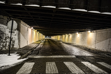 Vintage city bridge street tunnel at night.