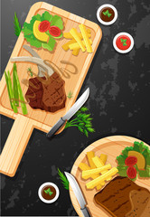 Steak and fries on wooden board