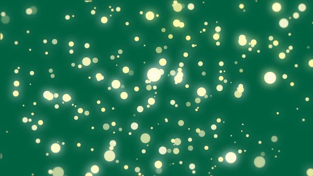 Sparkly dark green background with floating yellow light particles.