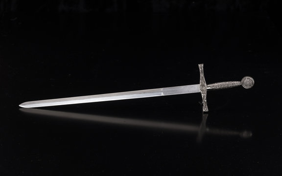 medieval sword on a black isolated background