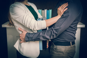 Man touching womans loin - sexual harassment in office