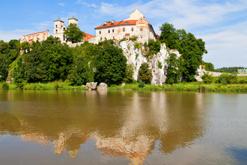Fototapeta na wymiar The Benedictine Abbey in Tyniec with wisla river on blue sky background