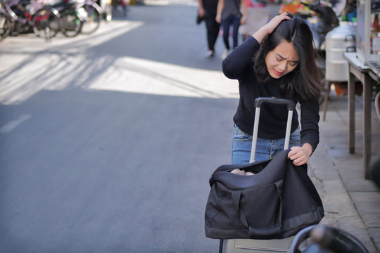 Sad, Negative Woman Traveler Or Tourist Getting Lost Her Money, Belongings, Passport Due To Pickpocketing Or Theft During Travel, Having Bad Travel Experience