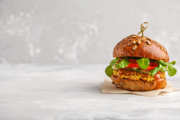 Vegan lentils burger with vegetables and curry sauce. Light background, copy space. Healthy vegan food concept. - obrazy, fototapety, plakaty