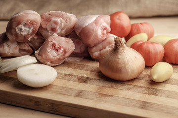 raw vegetables on wooden table, raw chicken meat on table, wooden background