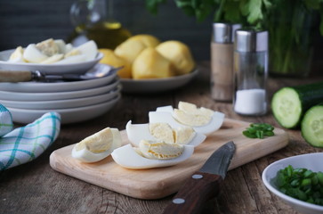 Slices of boiled eggs on a cutting board