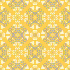 Seamless floral pattern. Bright yellow background with flower designs