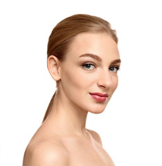 Portrait of beautiful young woman with clear skin on white background