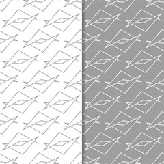 Gray and white geometric ornaments. Set of seamless patterns
