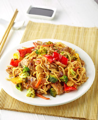 Plate of noodles with meat and vegetables