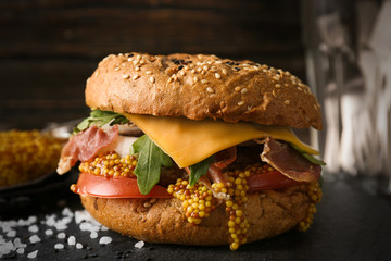 Tasty burger on slate plate