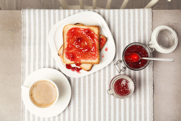 Delicious toast with sweet jam served for breakfast on table