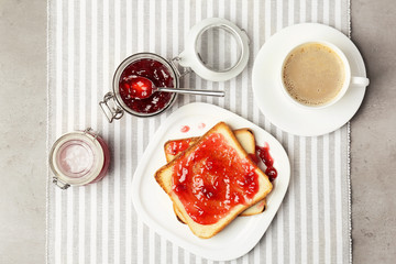 Delicious toast with sweet jam served for breakfast on table
