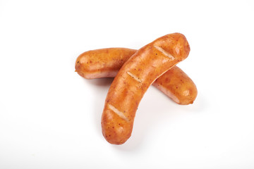 Grilled chicken sausages isolated on a white background