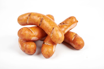 Grilled chicken sausages isolated on a white background