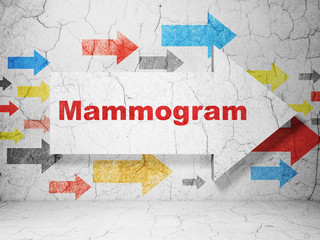 Medicine concept:  arrow with Mammogram on grunge textured concrete wall background, 3D rendering