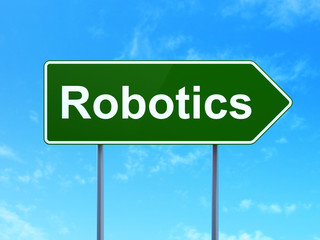 Science concept: Robotics on green road highway sign, clear blue sky background, 3D rendering